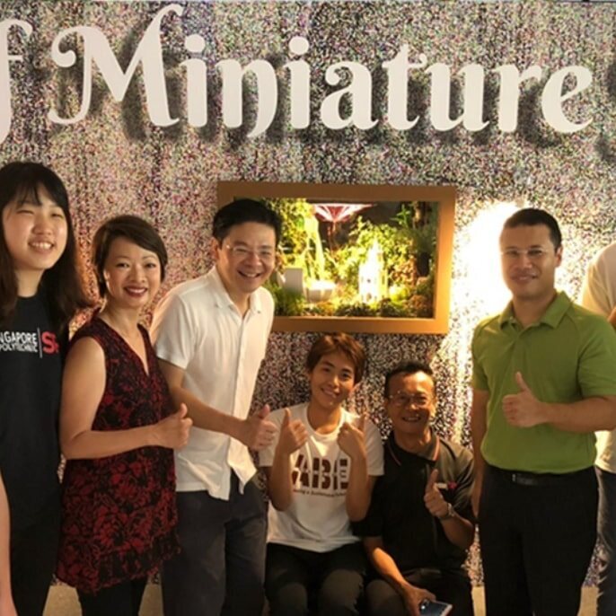 Staff and students happily posing together