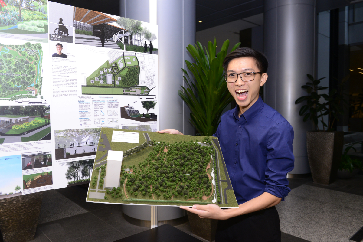 Student with Project Model at Exhibition