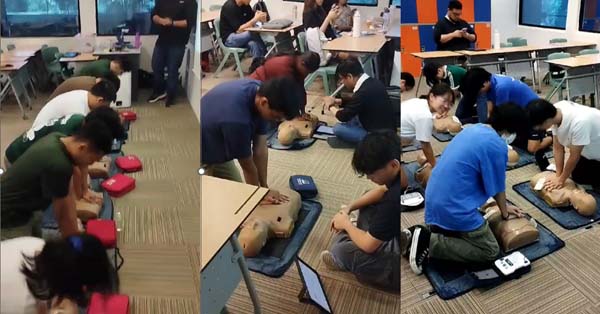 Students performing CPR on the dummies