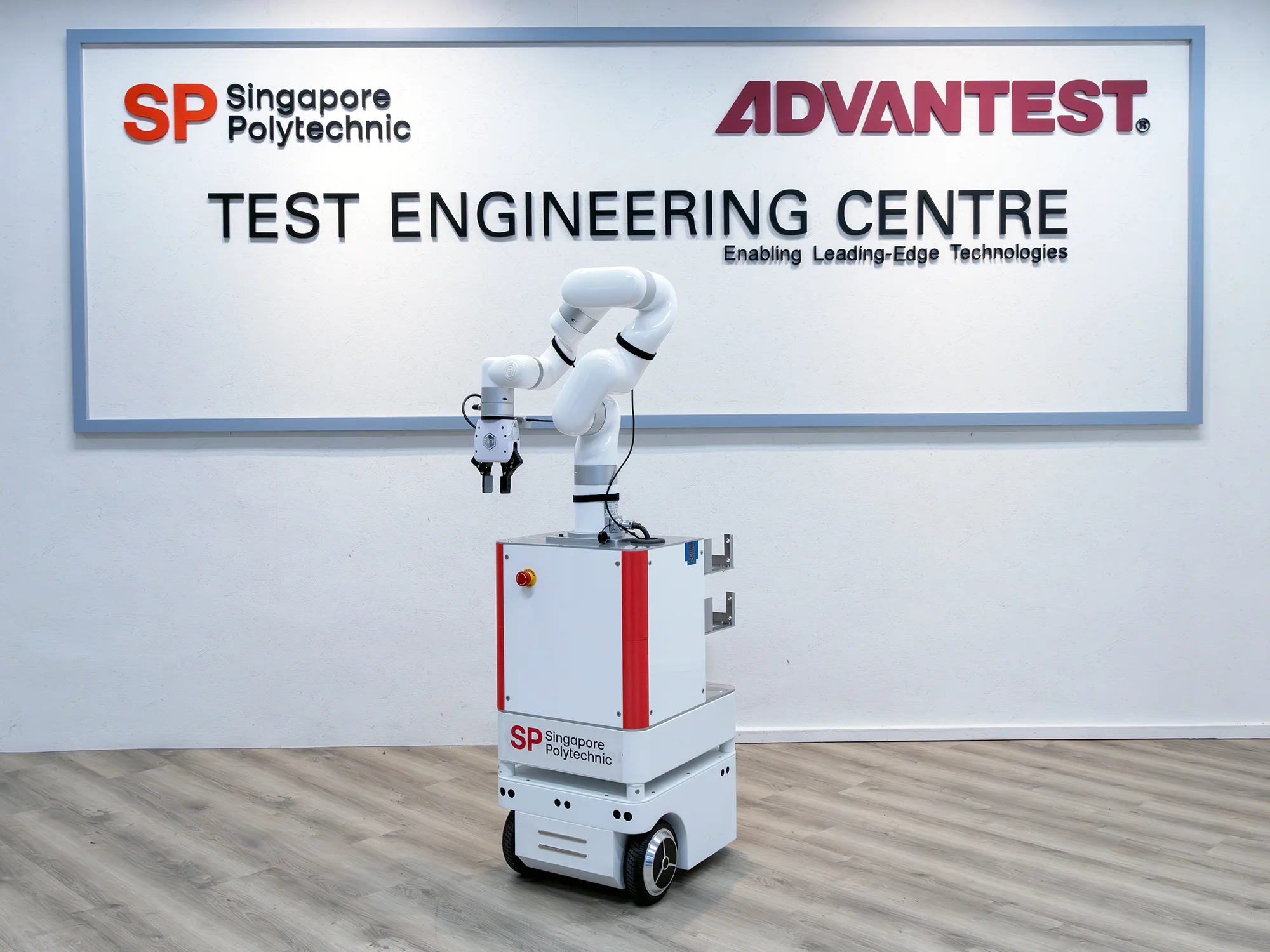 The mobile manipulator is in charge of doing machine tending