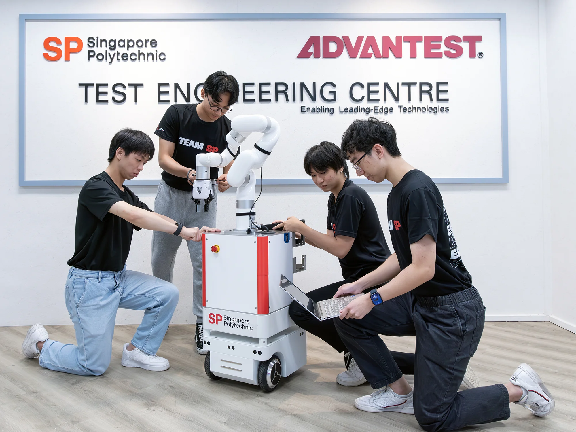 Students learning to use the mobile manipulator and its components.