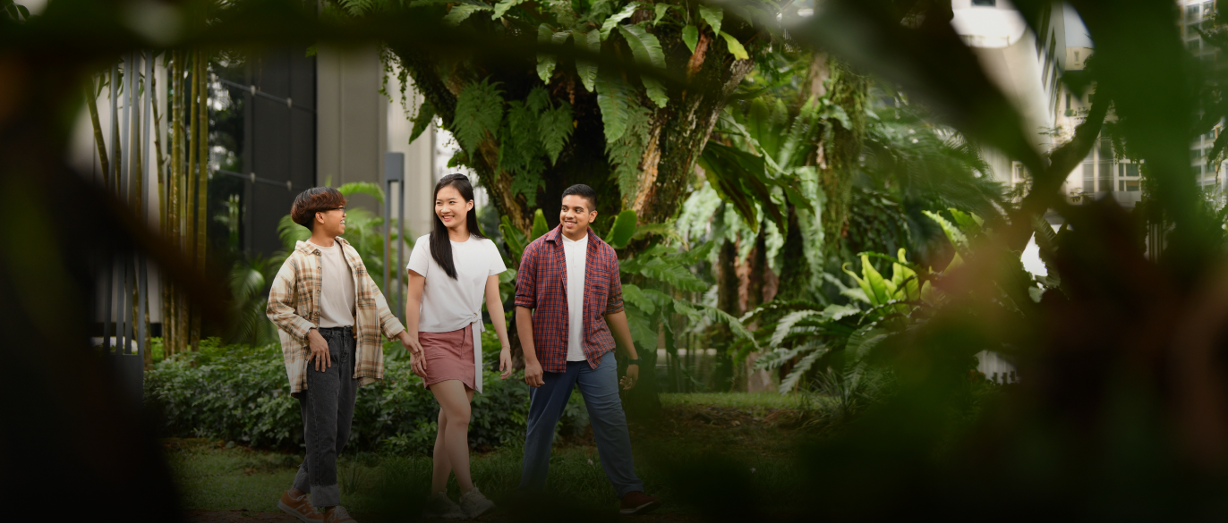 Students walking through a garden on campus
