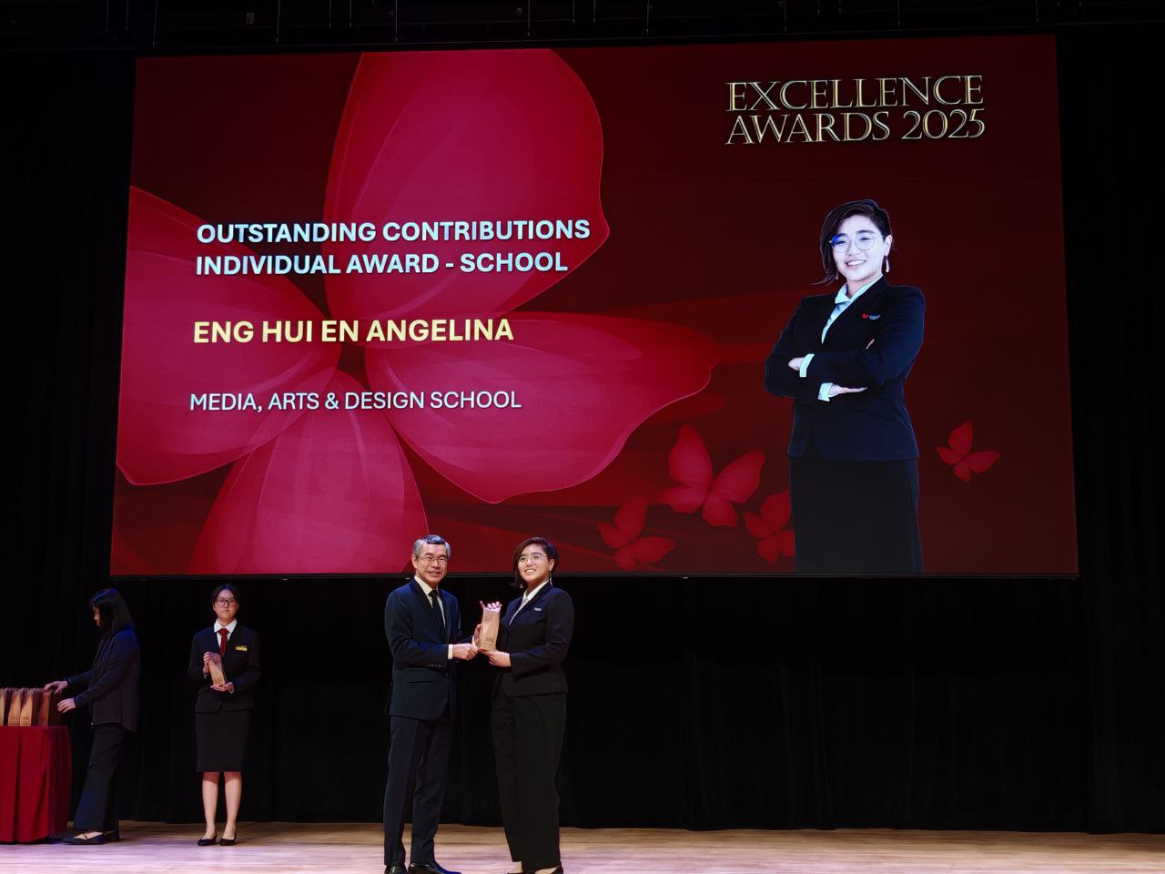 Eng Hui En Angelina receiving award from PCEO