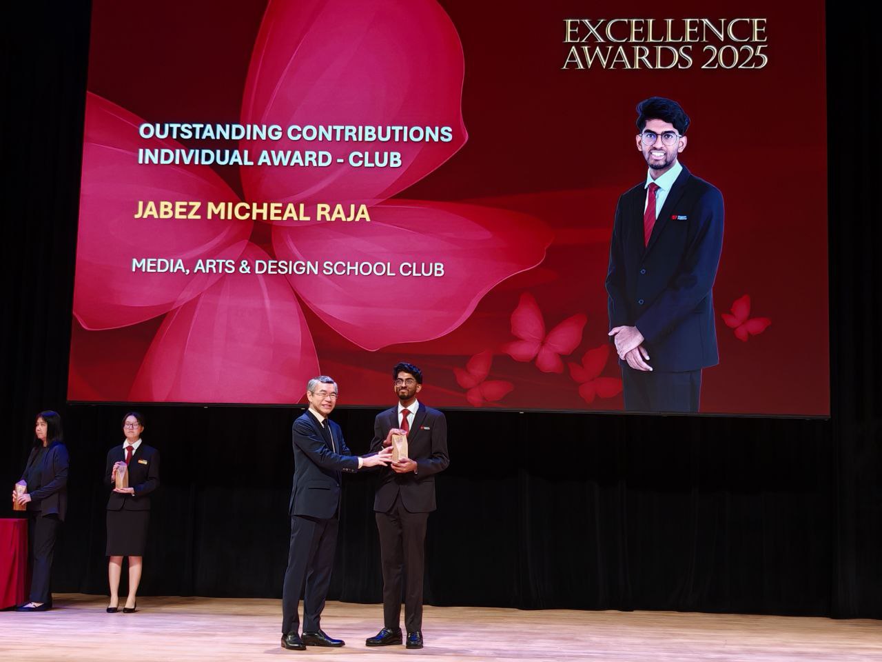 Jabez Michael Raja receiving award from PCEO
