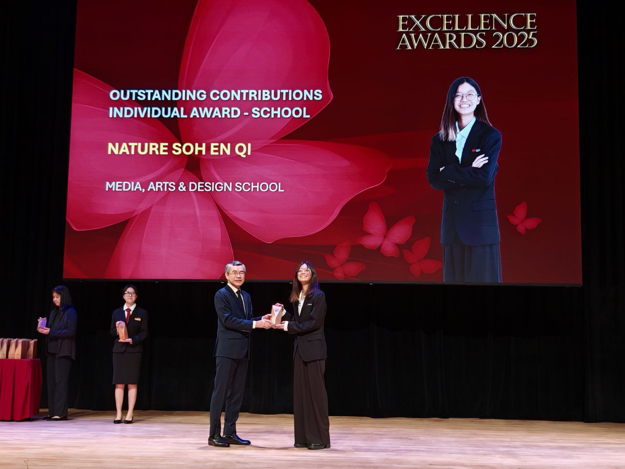 Nature Soh En Qi receiving award from PCEO