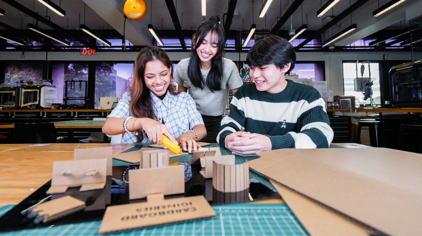 Students troubleshooting the Mini Electric Vehicle