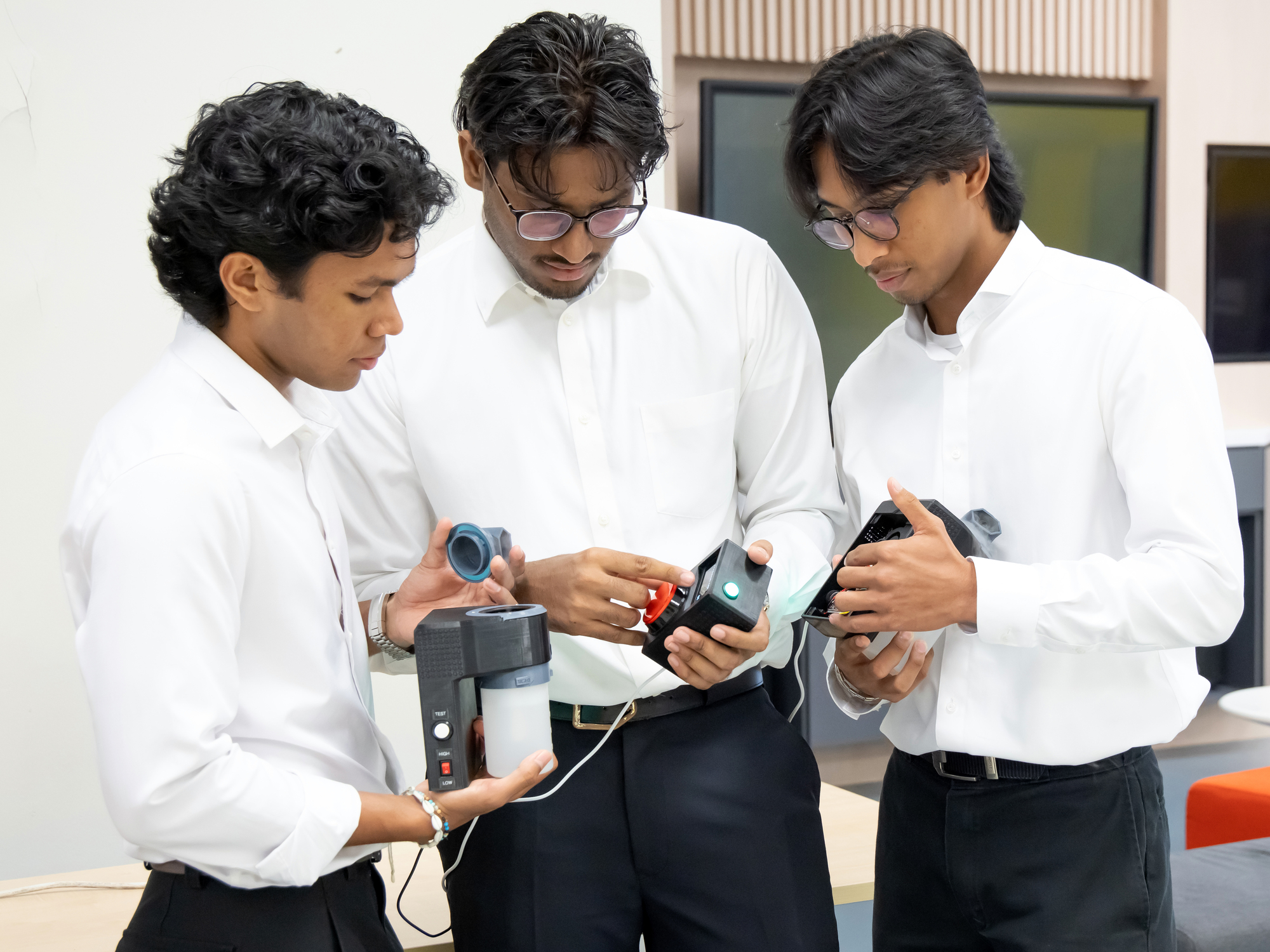 Students troubleshooting the Mini Electric Vehicle