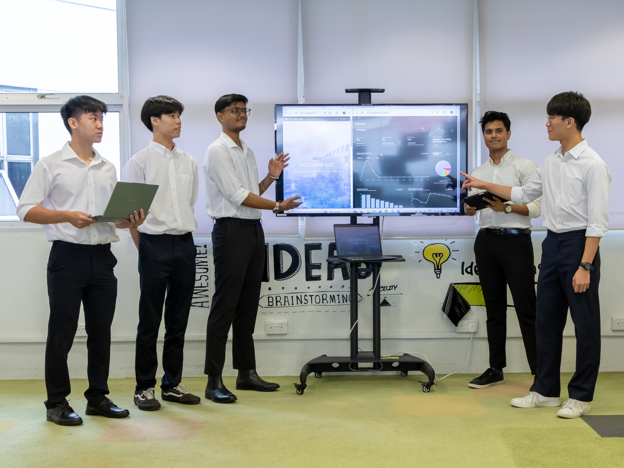 Students preparing the UAS for flight, from 4-rotor configuration to 8-rotor configuration.