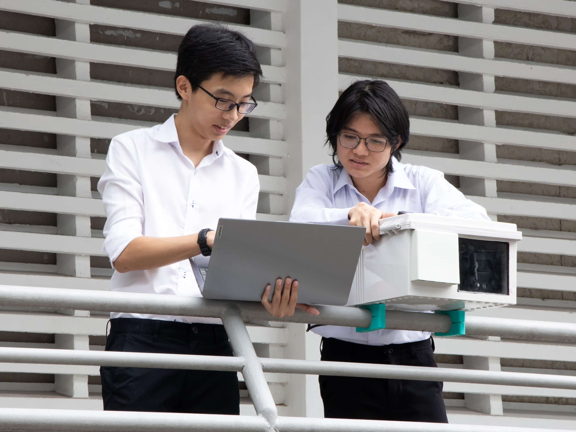 Students learning to use the mobile manipulator and its components.
